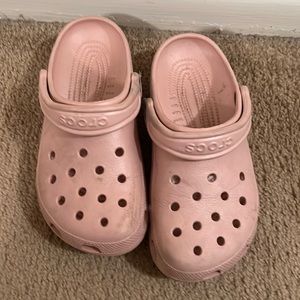 Used pink Crocs